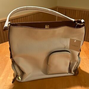 Liz Claiborne, white shoulder bag with buckles and zipper pockets.